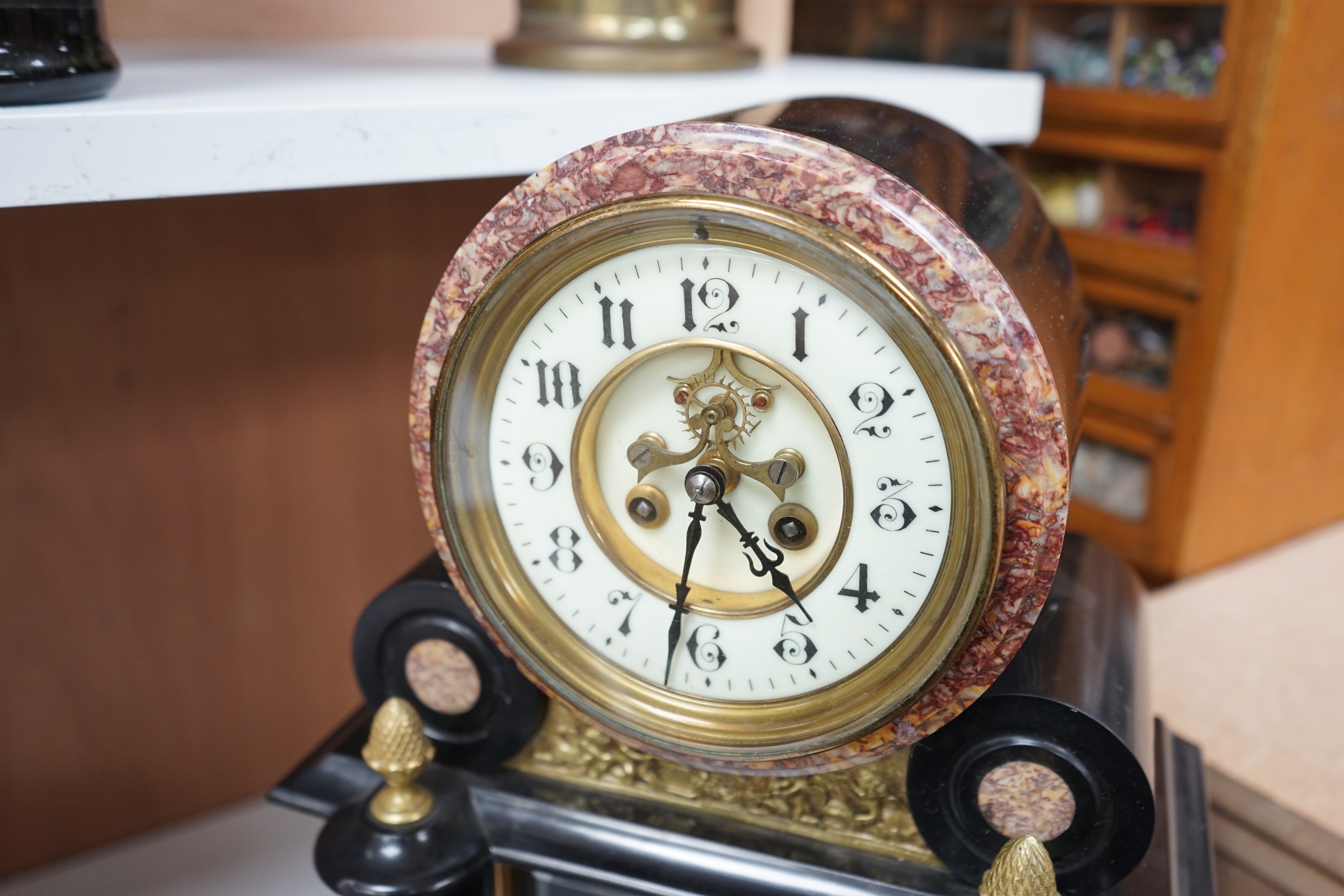 A large Edwardian decorative slate and marble clock, with visible Brocot escapement, height 48cms